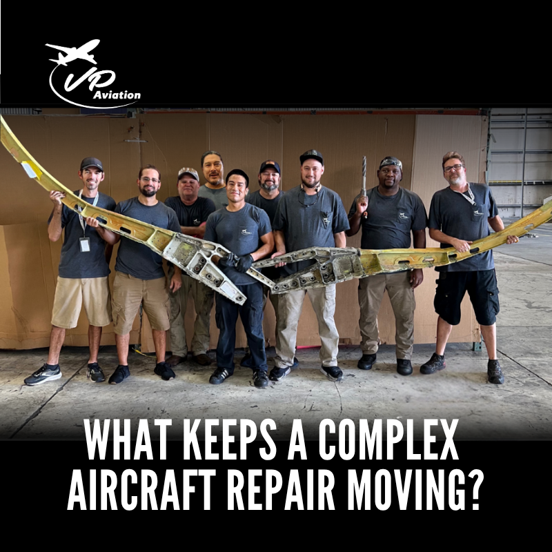 VP Aviation Mobile Response Team holding removed B737 pickle fork components.